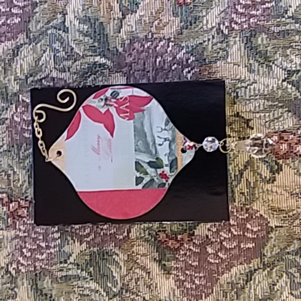 Festive Glass Ornament with Red and Green Outdoor Scene